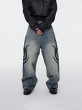 Verwaschene Tribal-Jeans